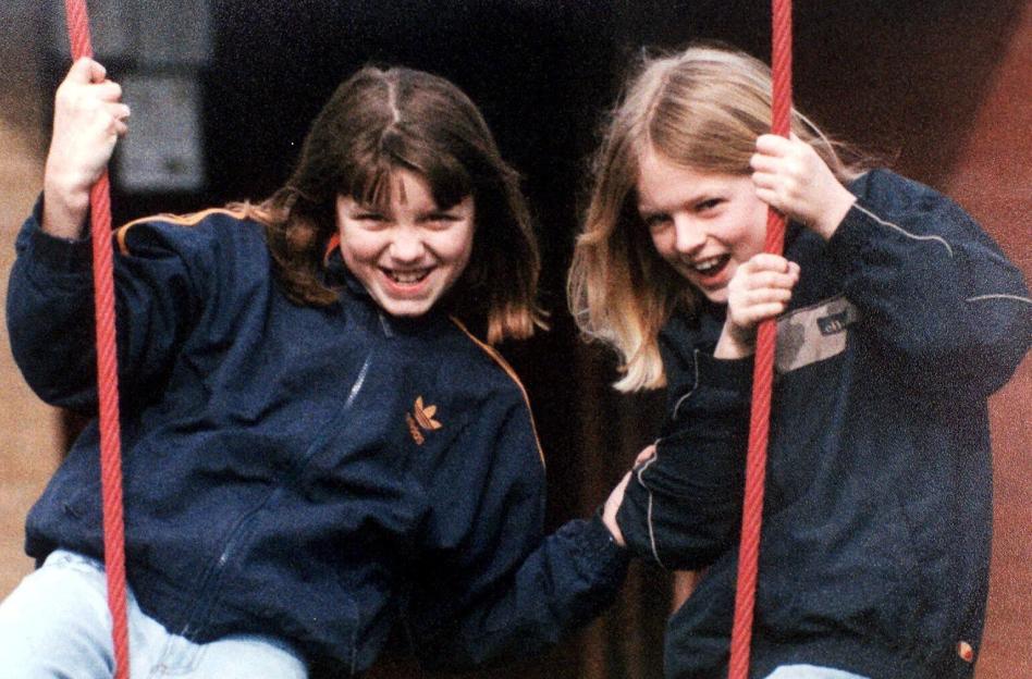 Jessica Chapman and Holly Wells smiling while holding onto ropes.
