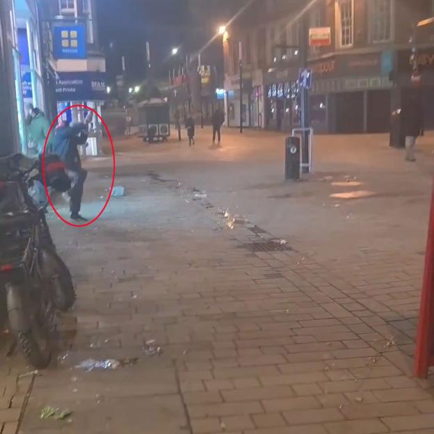Video grab of young people throwing eggs in Wolverhampton city center.