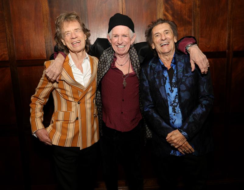 Mick Jagger, Keith Richards, and Ronnie Wood pose backstage during The Rolling Stones' new album launch event.