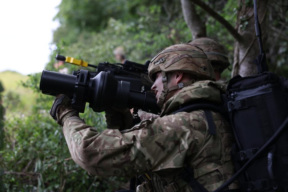 The HMS Dragon warship, decorated with a large red dragon, is being towed by the SD Tempest.