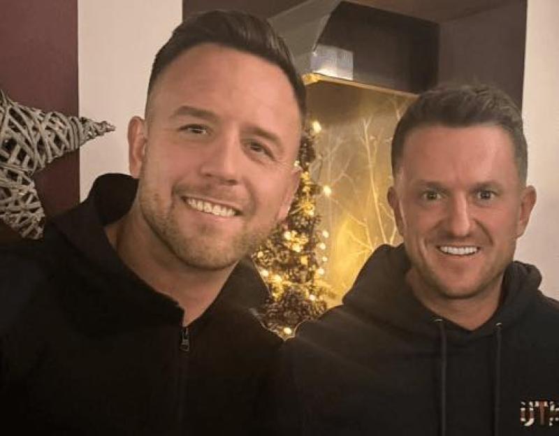 Danny Thomas and Tommy Robinson smiling together.