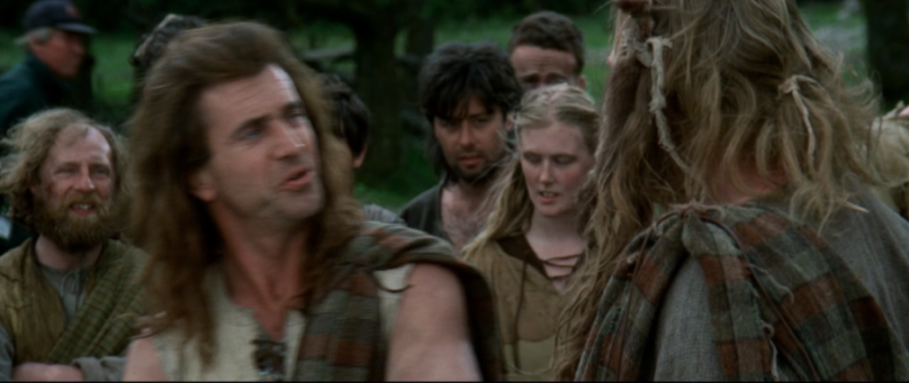 A group of men and a woman in medieval clothing.