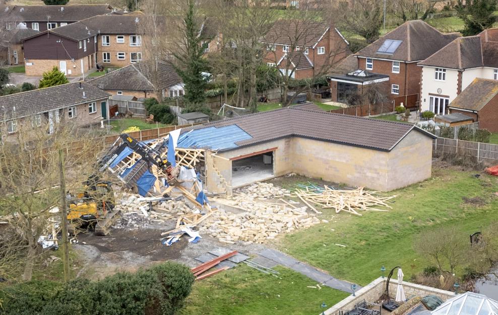Demolition of the spa building at Captain Tom Moore's family home.