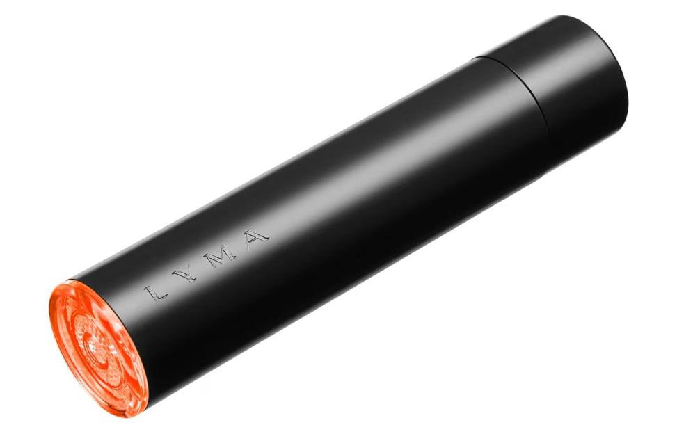 Black cylindrical Lyma laser with an orange tip, angled upward.