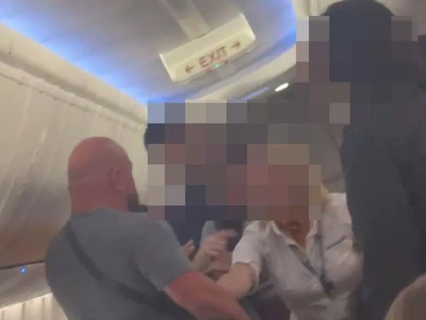 Shocking moment Ryanair cabin crew screams ‘sit down’ after tourist ‘ignored seatbelt sign & attacked passengers’