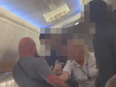 Shocking moment Ryanair cabin crew screams ‘sit down’ after tourist ‘ignored seatbelt sign & attacked passengers’