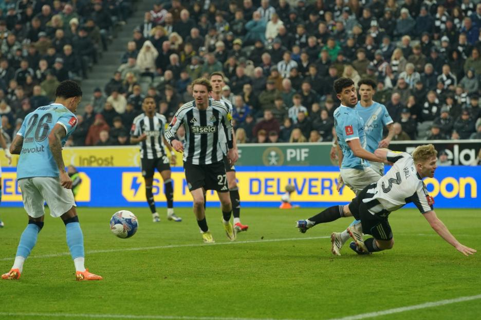 Manchester City's Savinho scores during the FA Cup soccer match against Newcastle.