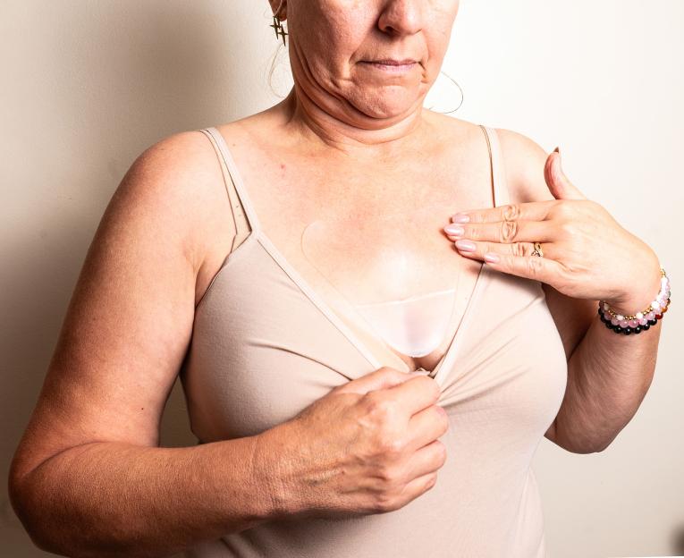 Kiara Roberts shows her chest patch test at home.