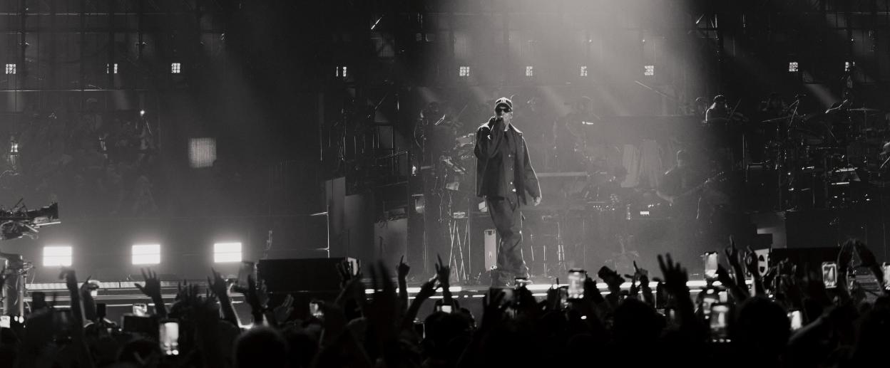 Jay-Z performing on stage at Tottenham Hotspur Stadium.