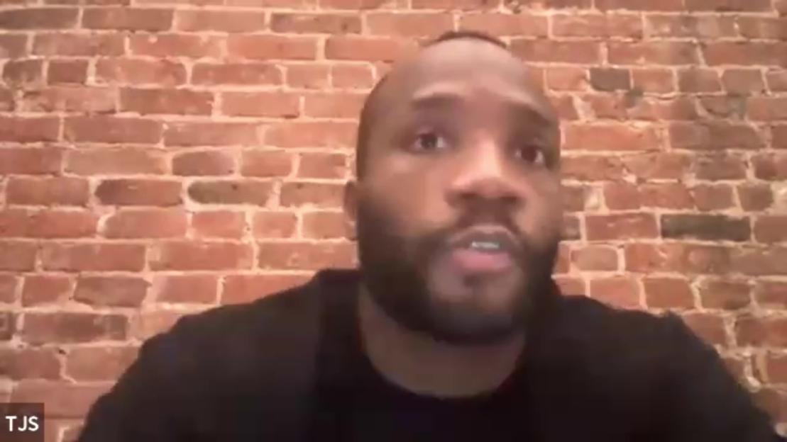 Leon Edwards speaking on a video call in front of a brick wall.