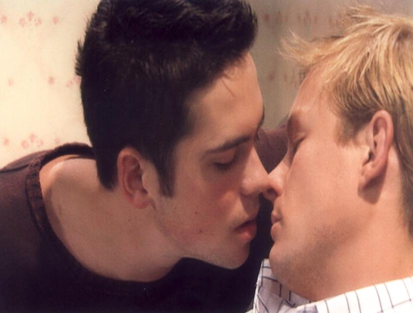 Nick Tilsley reacts with surprise as Todd Grimshaw kisses him in a scene from Coronation Street.