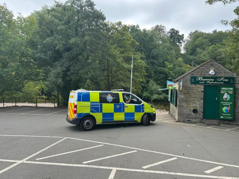 Police van at the scene of an emergency by the River Swale.