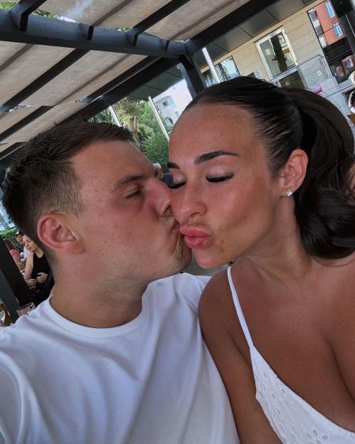 Stephanie Davis and Joseph McKalroy kissing.