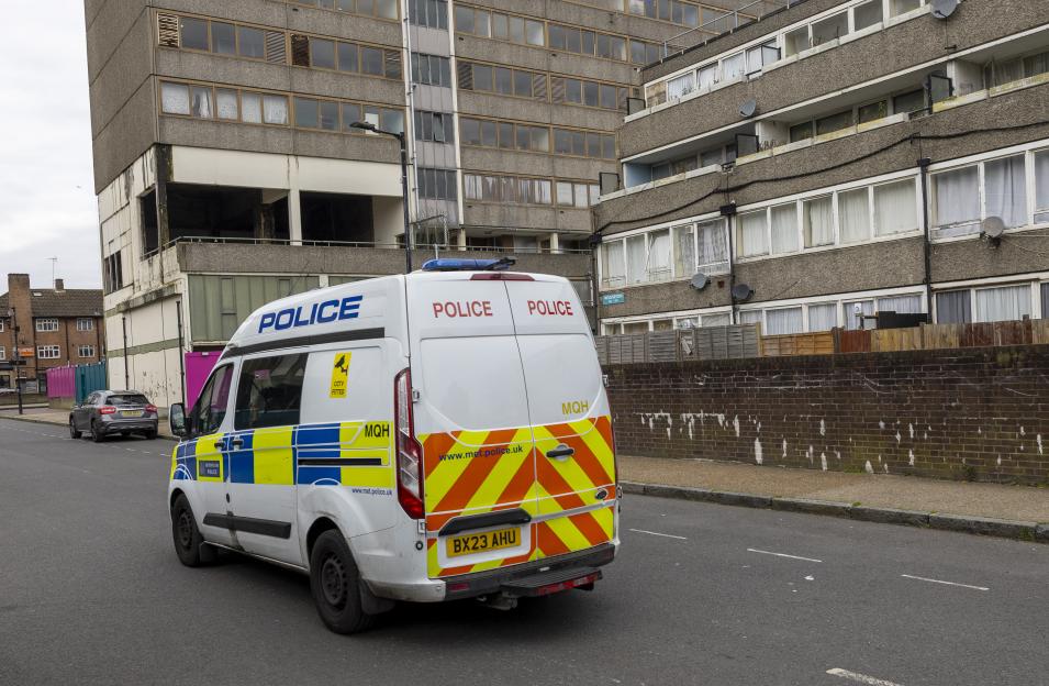 A police van parked in front of the notorious Aylesbury Estate in Walworth, South London, slated for demolition.