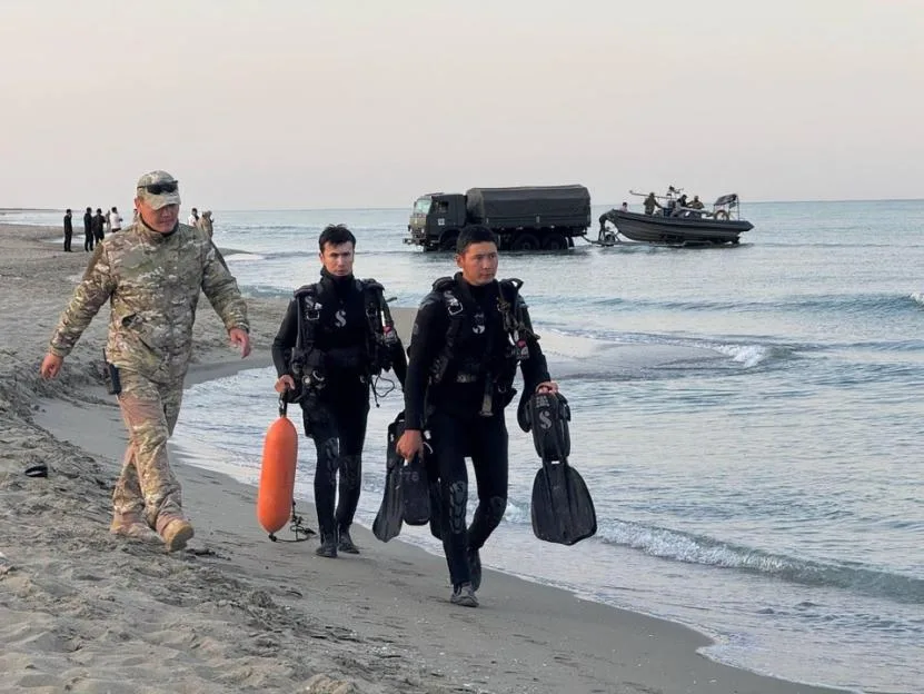 A total of 14 Kazakh troops - mainly conscripts in their late teens or early 20s - drowned under the weight of their combat gear during a bungled bad-weather military drill in the Caspian Sea.