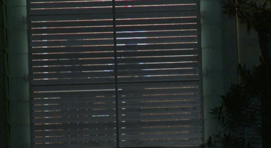 Closed blinds on a window.