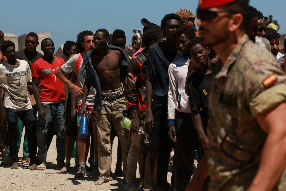 Migrants queuing for water from the Spanish military in Ceuta.