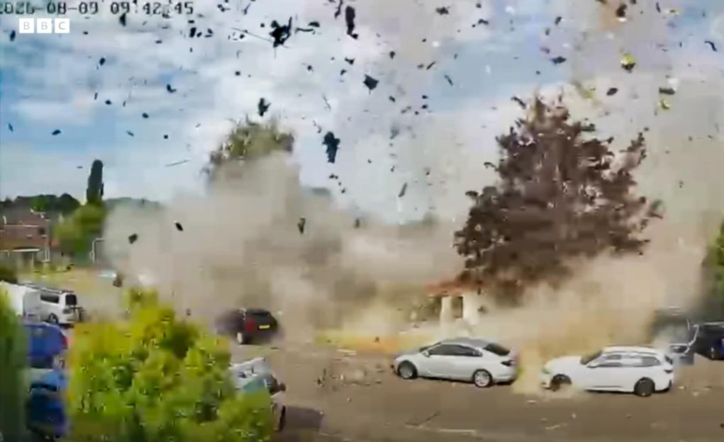 A gas explosion destroying a bungalow, with debris and smoke filling the air.