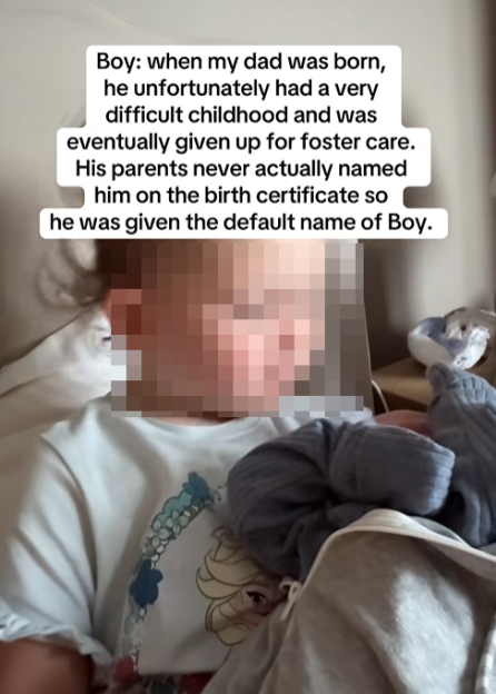 A person wearing a white shirt with a cartoon character printed on it, with text overlay describing a difficult childhood and being named Boy.