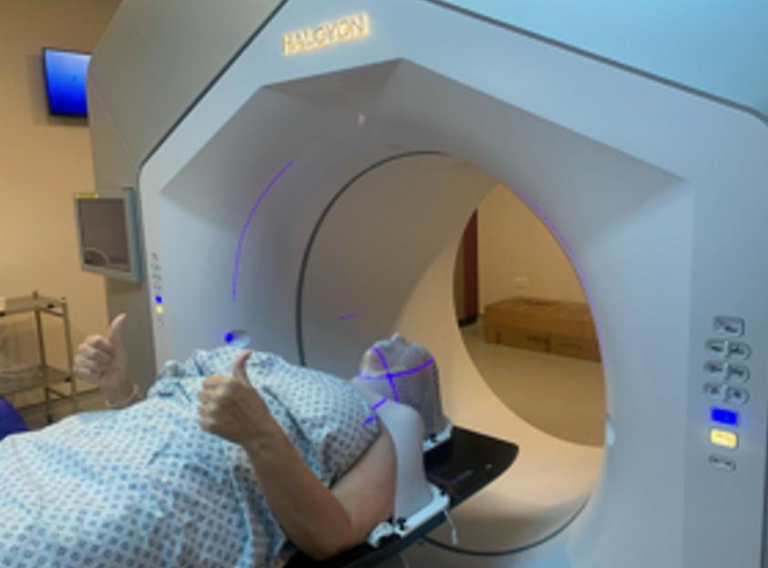 A patient undergoing radiotherapy treatment for tongue cancer.