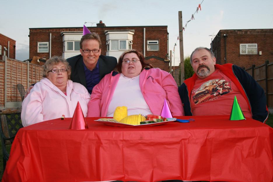 Steve Miller poses with the Cuff family, participants on the television show "Fat Families."