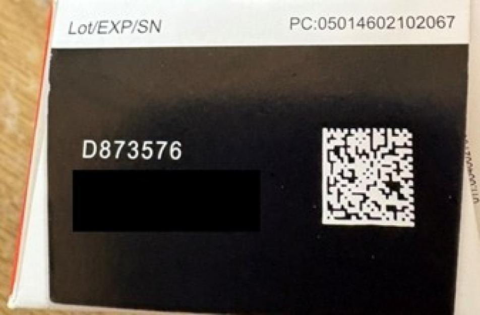 A product label showing the text "Lot/EXP/SN," a PC number, and "D873576" with a QR code next to it.