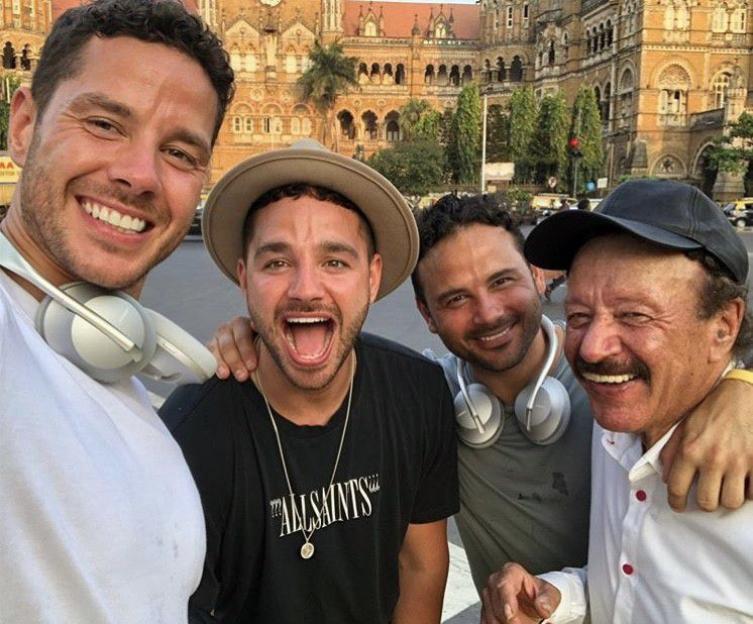 Scott Thomas, Adam Thomas, Ryan Thomas, and their father Dougie at Mumbai Station.