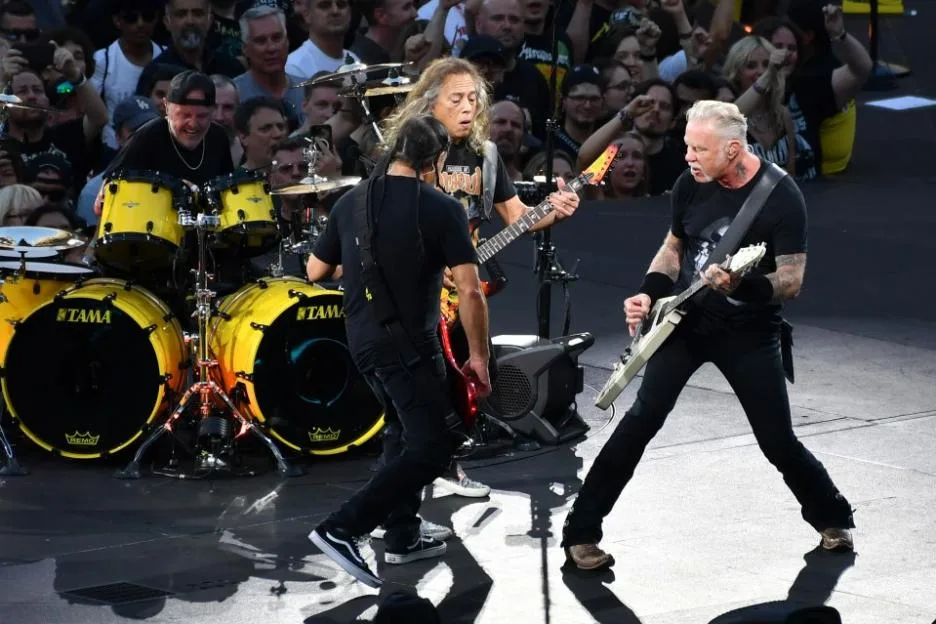 Metallica members Lars Ulrich, Robert Trujillo, Kirk Hammett and James Hetfield perform on stage during a concert.