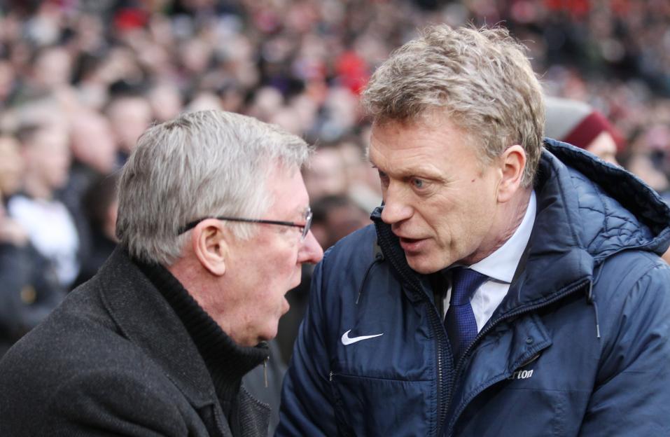 Everton manager David Moyes speaking to Manchester United manager Sir Alex Ferguson before a match.