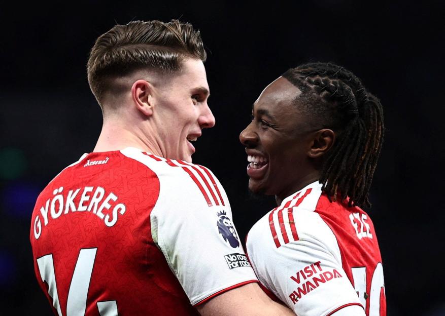 Arsenal players Gyokeres and Eze smiling together.
