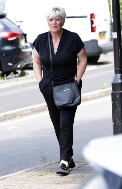 Lisa Farnsworth walking down the street at her benefit fraud hearing.