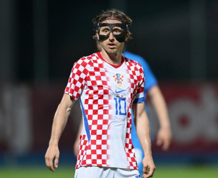 Luka Modric wearing a protective face mask during an international friendly match between Croatia and Slovenia.