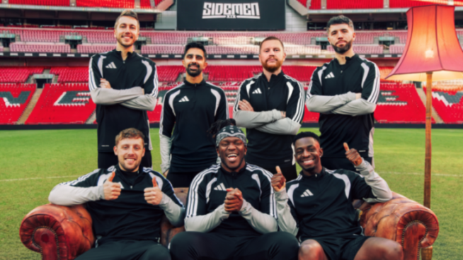The Sidemen group posing for a picture in a stadium.