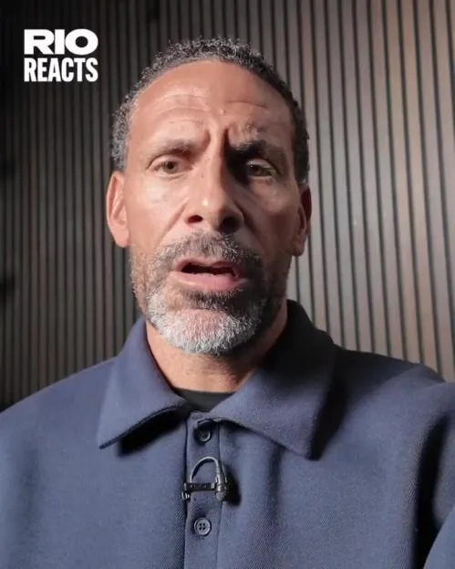Rio Ferdinand speaking in a video with the "Rio Reacts" logo visible in the upper-left corner.
