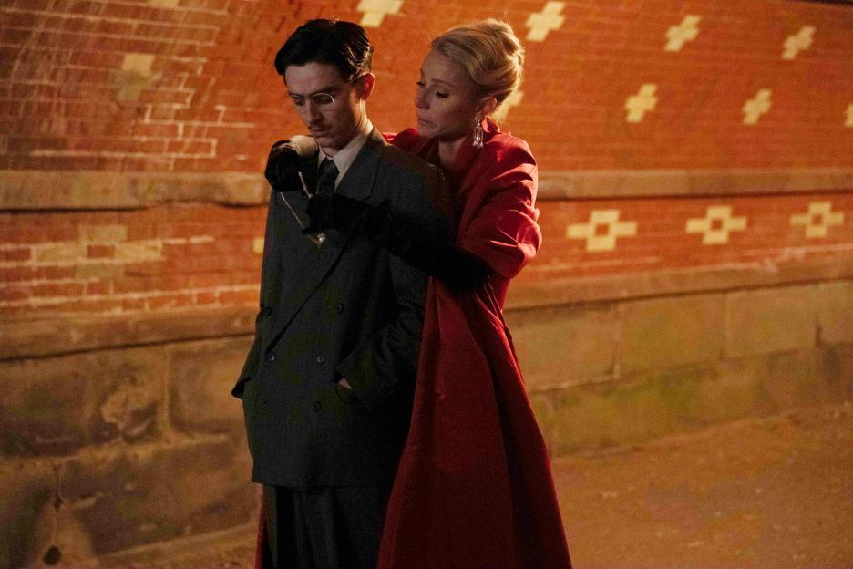 Film still of Gwyneth Paltrow embracing Timothée Chalamet in "Marty Supreme".