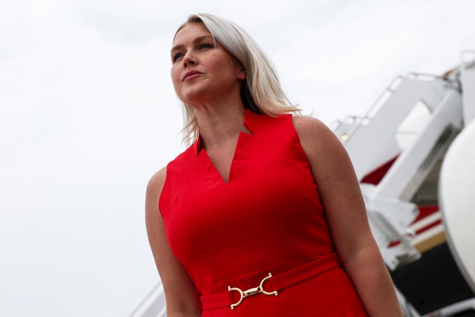 White House Press Secretary Karoline Leavitt in a red dress.