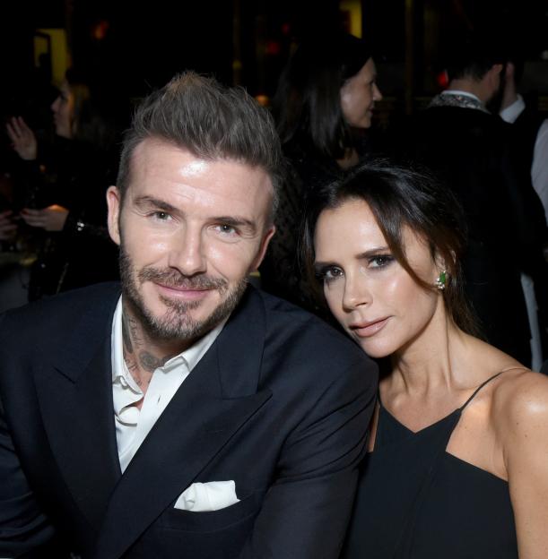 David and Victoria Beckham smiling.