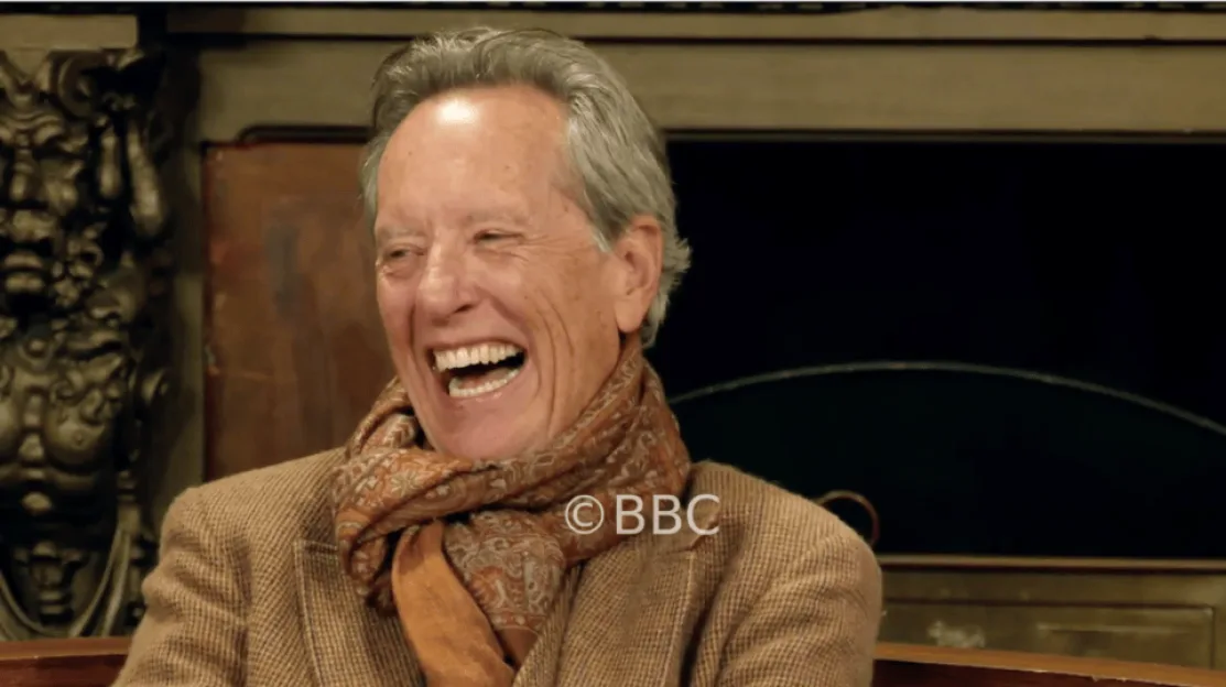 Richard E Grant laughing.