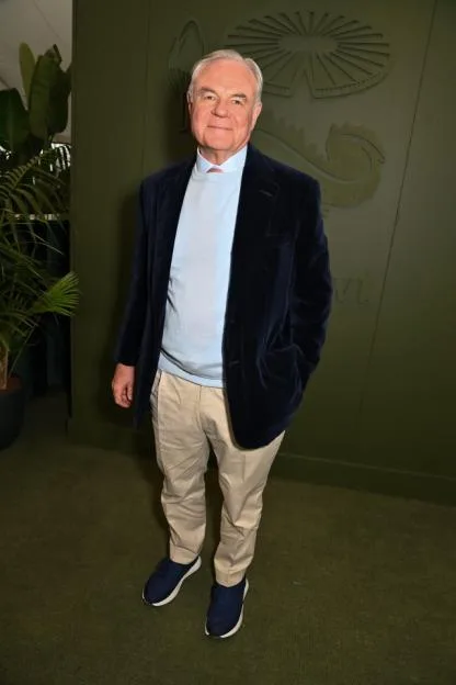 Koos Bekker poses for a full-body portrait at a dinner co-hosted by Burberry and The Newt in Somerset at the RHS Chelsea Flower Show.