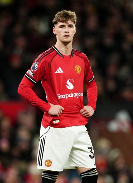 Jack Fletcher in a red Manchester United jersey and white shorts.