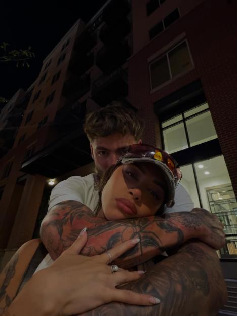 Sam Taylor and his new girlfriend embracing.