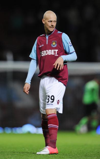 West Ham United player Dylan Tombides standing on the field.