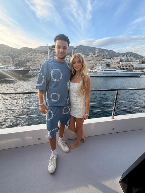 Princess Andre and Junior Andre pose together on a yacht in Monaco.