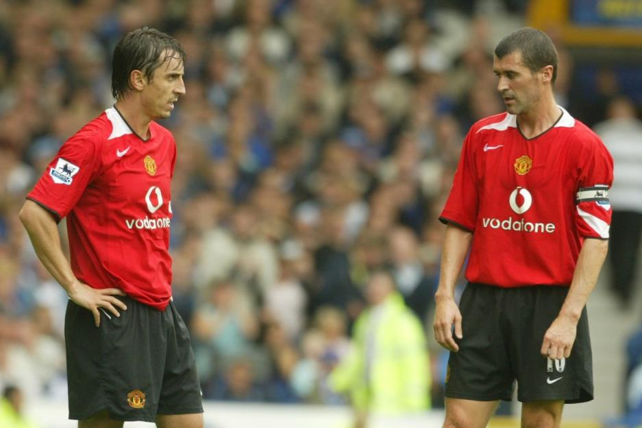 Gary Neville and Roy Keane in Manchester United uniforms.