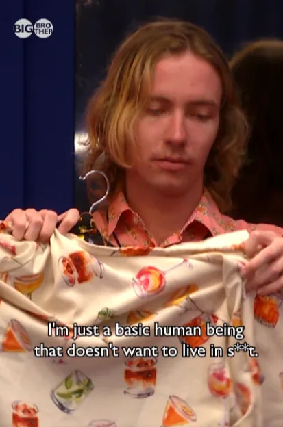 A Big Brother housemate holding up a patterned shirt with the caption, "I'm just a basic human being that doesn't want to live in s***."