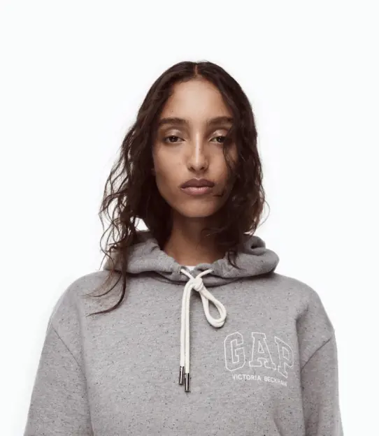 A model wearing a grey Gap x Victoria Beckham hoodie.