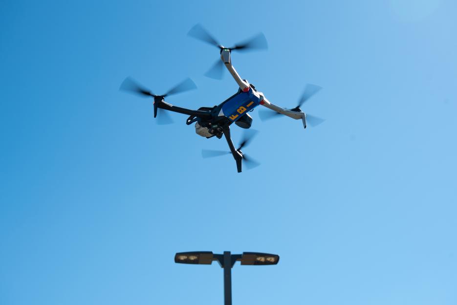 FBI drone flying in a clear blue sky.