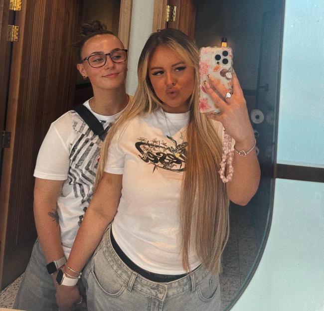 Charly Ann and Emily posing for a mirror selfie.