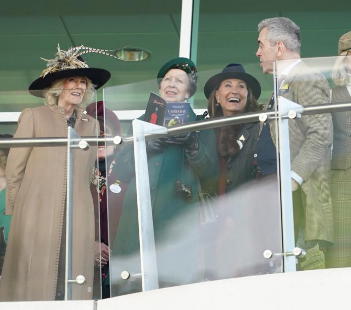 Queen Camilla, Princess Royal, and Carole Middleton laughing at the Cheltenham Festival.
