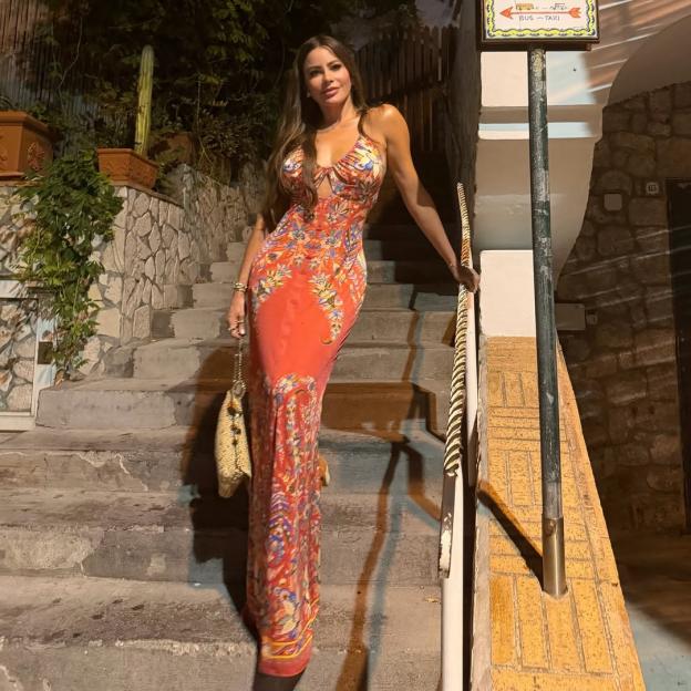 Sofia Vergara in a plunging dress, celebrating her birthday in Italy.